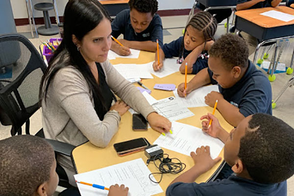 Teacher working with a small group at a table